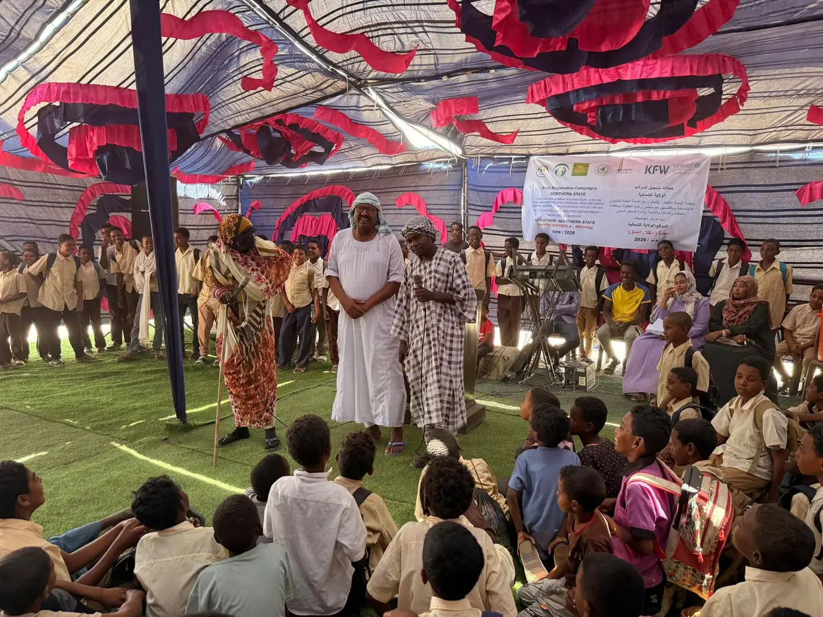 Pupils watch an awareness drama about birth registration in Al-Khannag, Dongola locality
